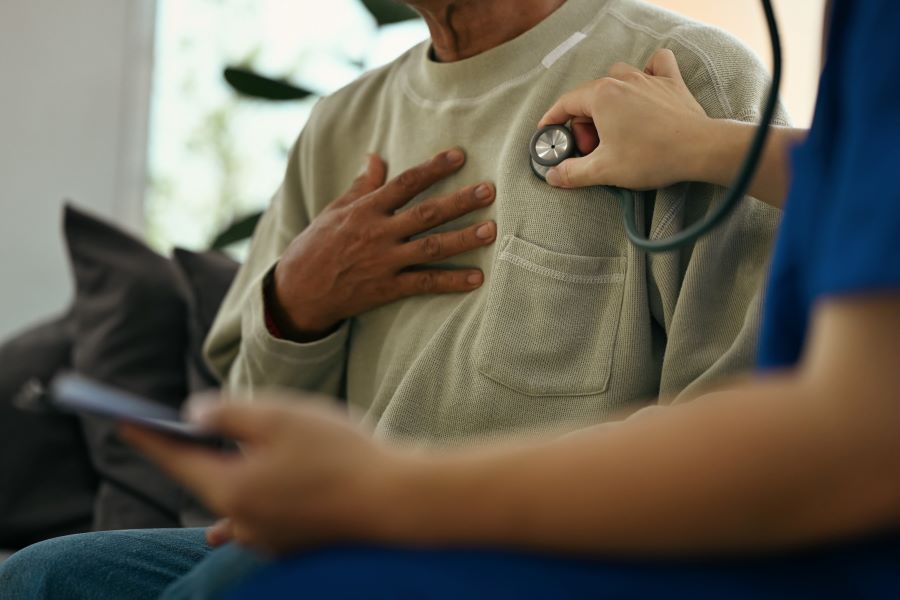 Doctor checks patient’s heart.