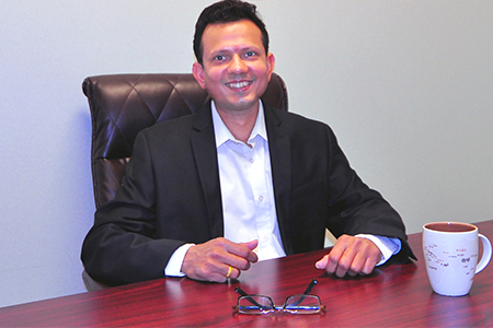 Kaushal Solanki, Ph.D., sits at a desk.