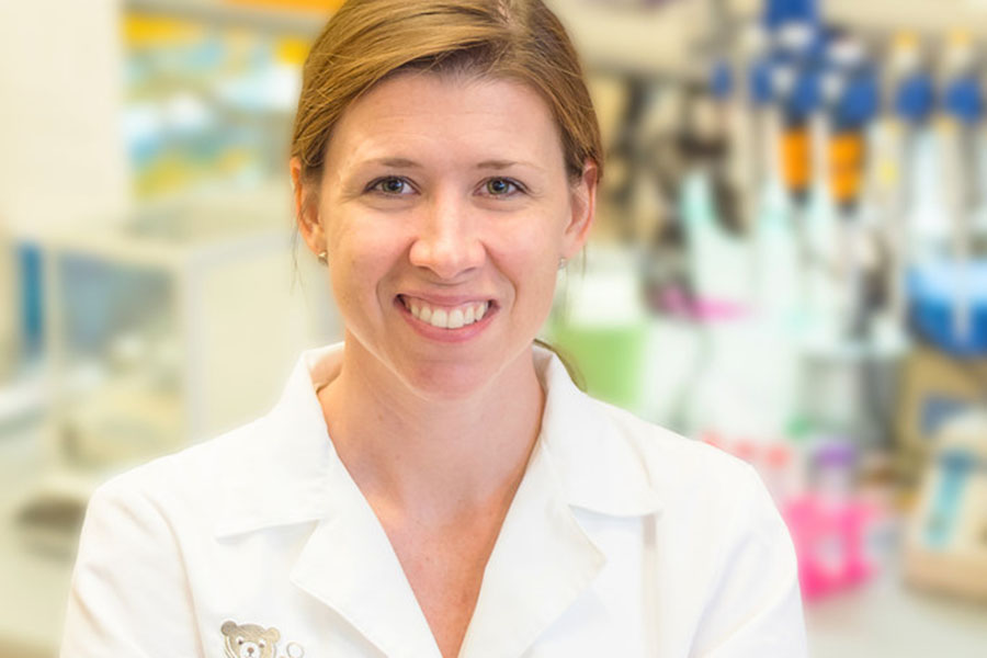 Nikki Posnack, Ph.D., stands in a lab.