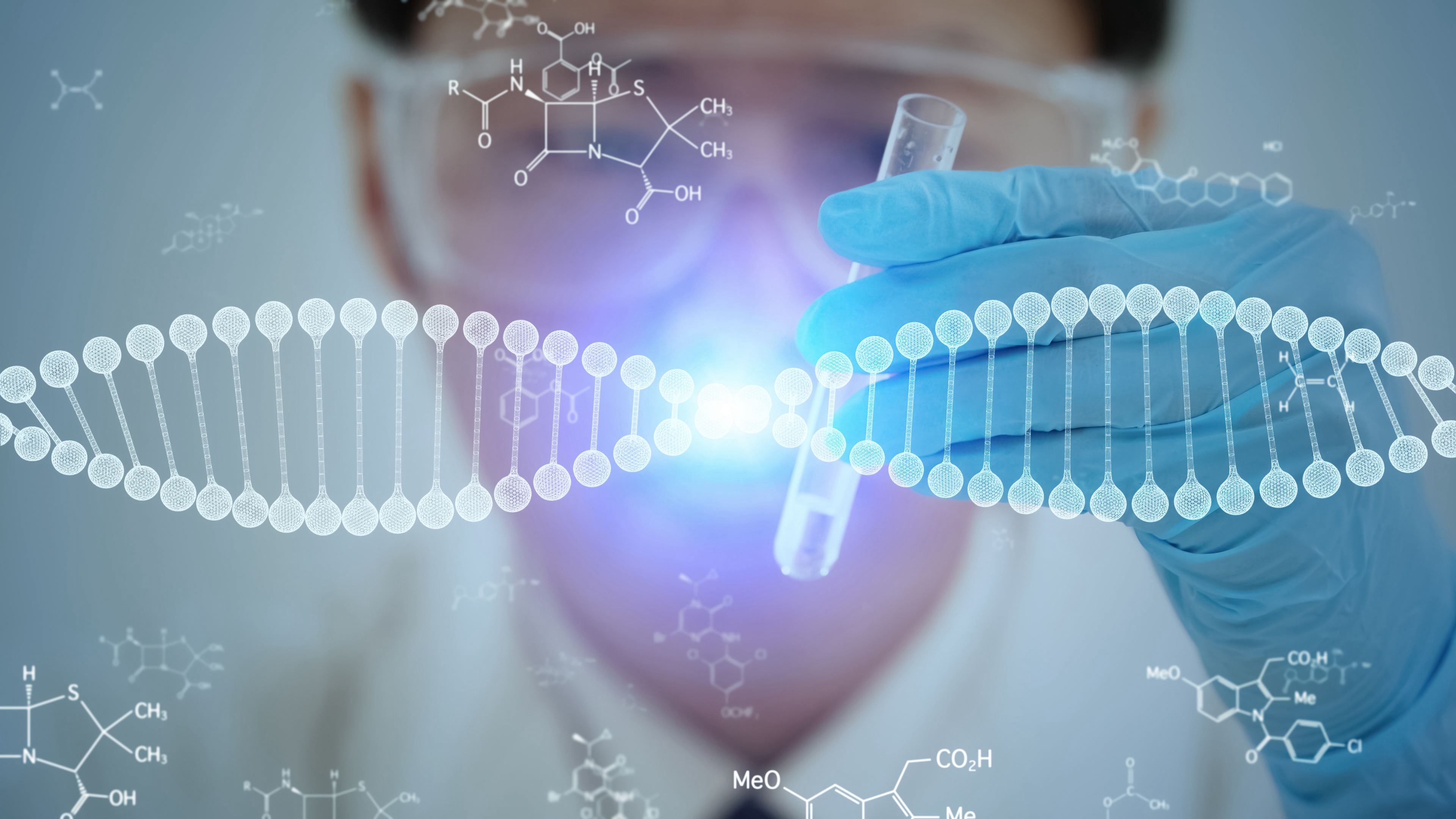 Scientist wearing goggles and gloves examines a test tube, overlaid with digital DNA helix and chemical formulas